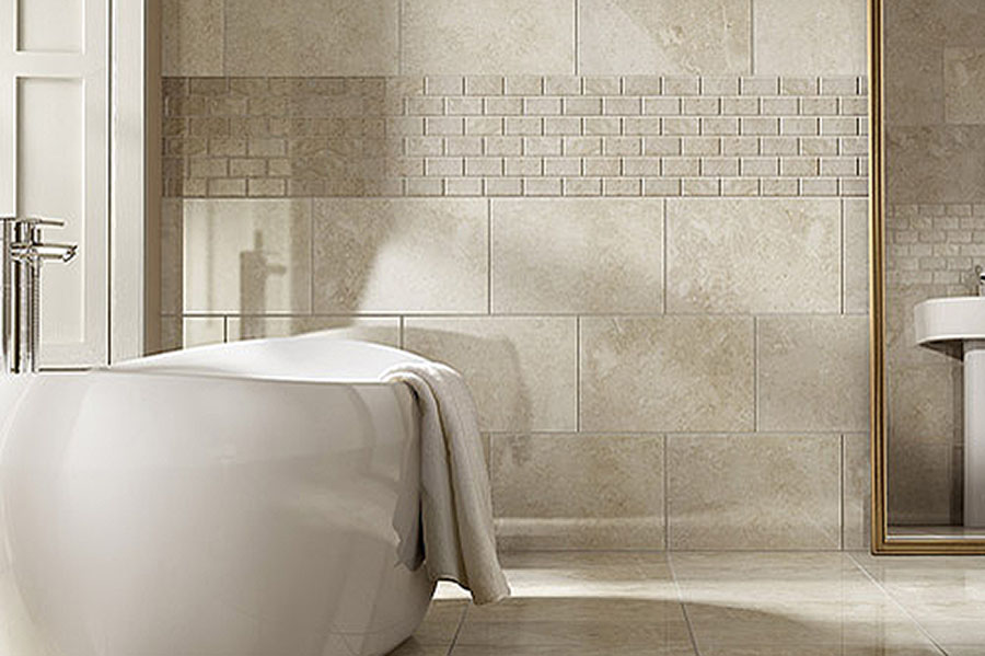Pale marble wall and floor tiles used in this elegant family bathroom