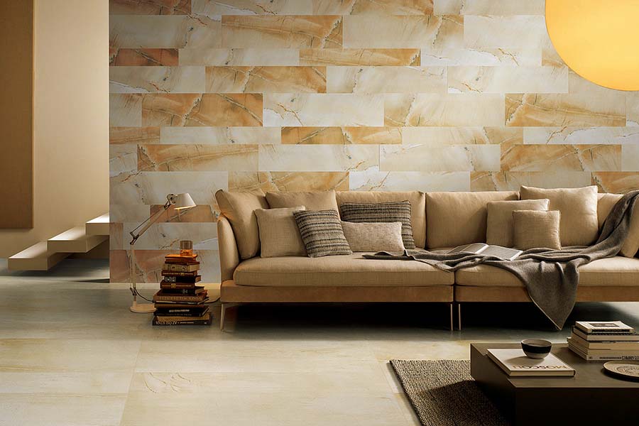 Sandstone effect porcelain tiles in a rich golden colour have been used to create this eye-catching feature wall