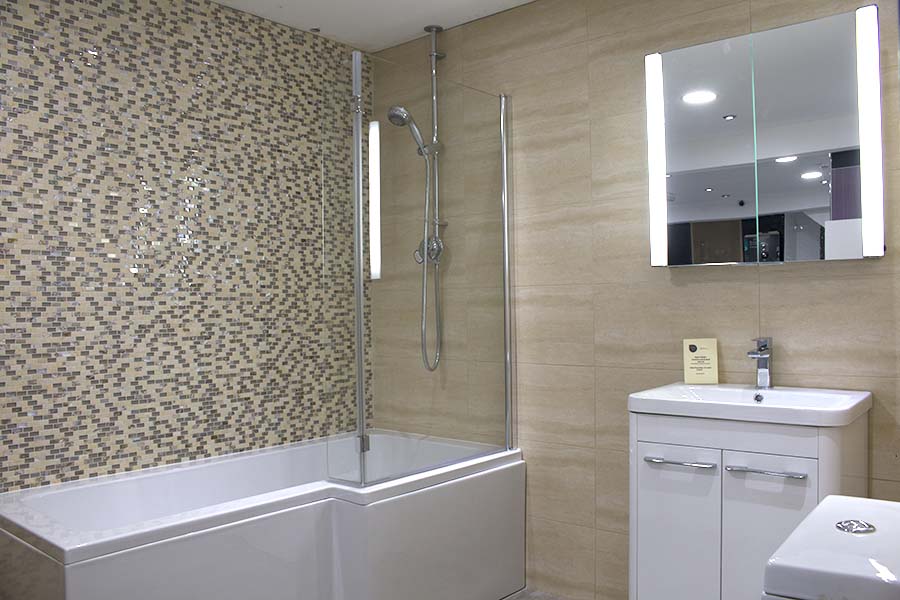 Vibrant yellow mosaic tiles with metallic highlights make a feature of this over-bath shower